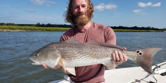 Man with Beard Holding Fish