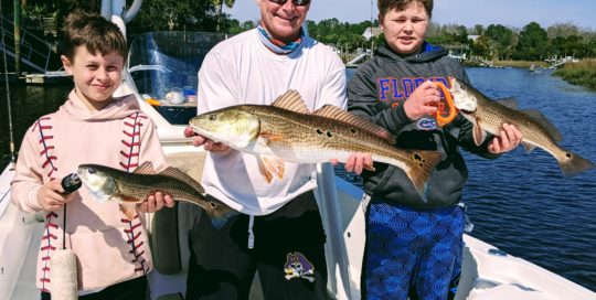 Father and sons fishing folly beach