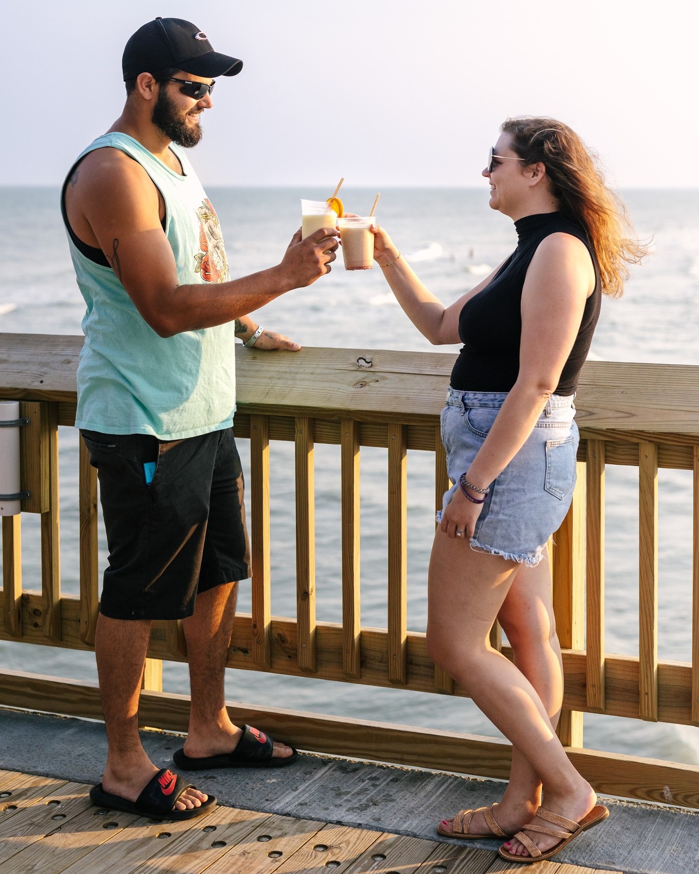 646715433_1324914742997963_7221352013418816190_n couple on the folly beach pier together